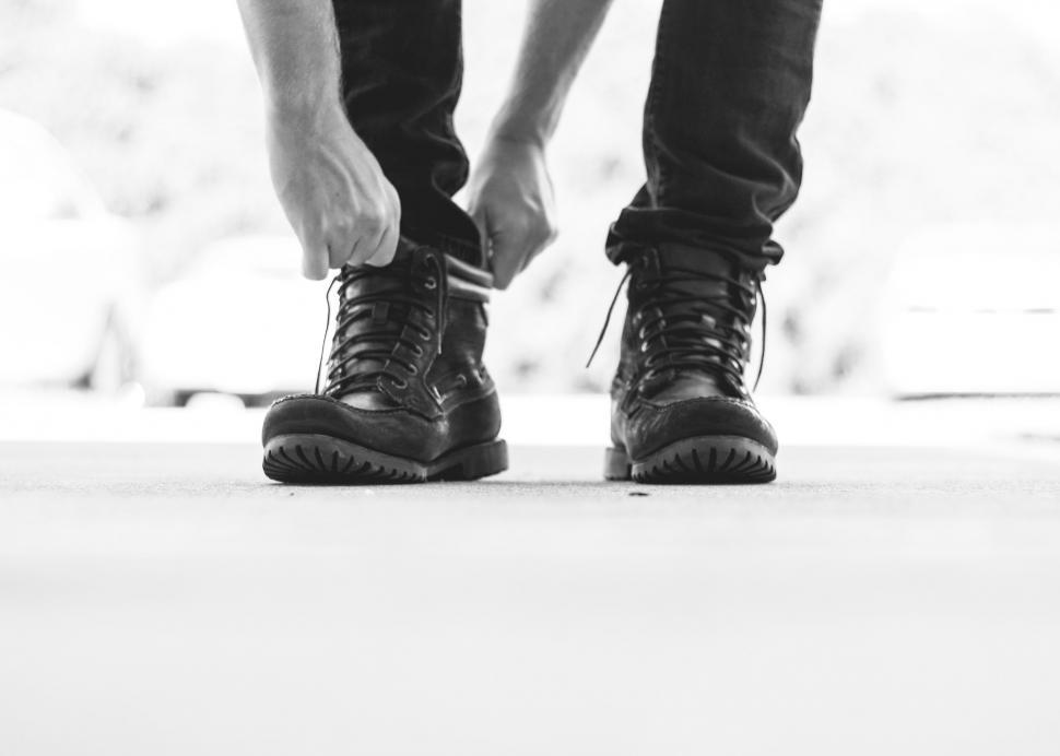 Free Image of Person standing in heavy black boots on street 