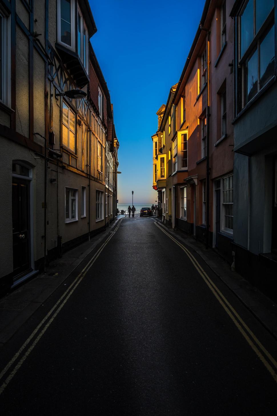 Free Image of Urban Street With Buildings on Both Sides 