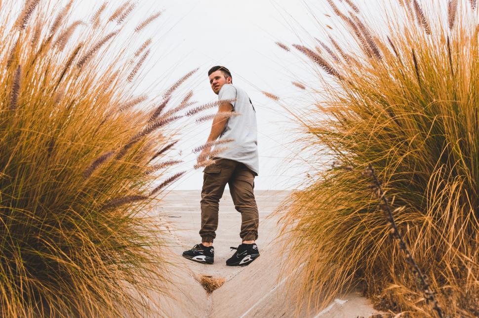 Free Image of Man Standing in Tall Grass 