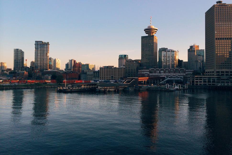 Free Image of Cityscape Overlooking a Vast Body of Water 