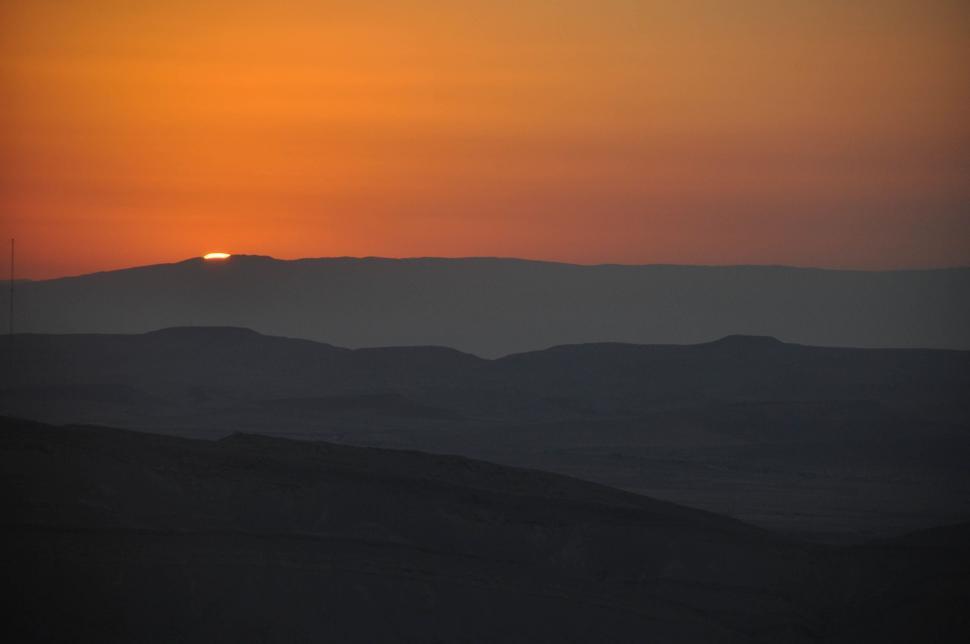 Free Image of Sun Setting Over Mountain Range 