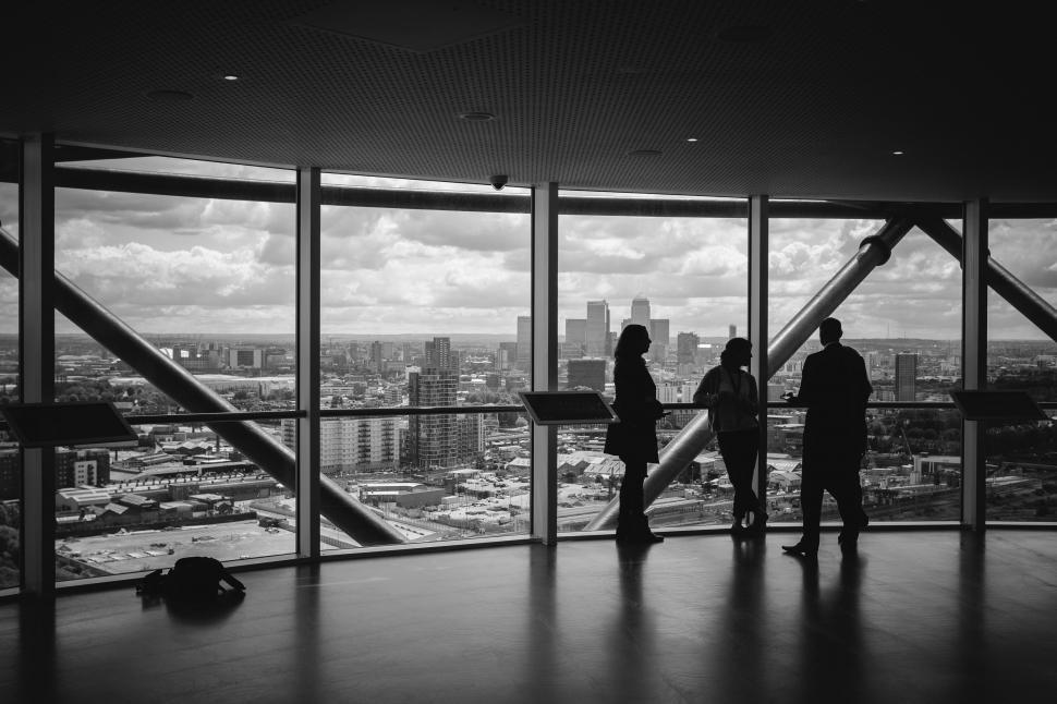 Free Image of Group of People Standing in Front of a Window 