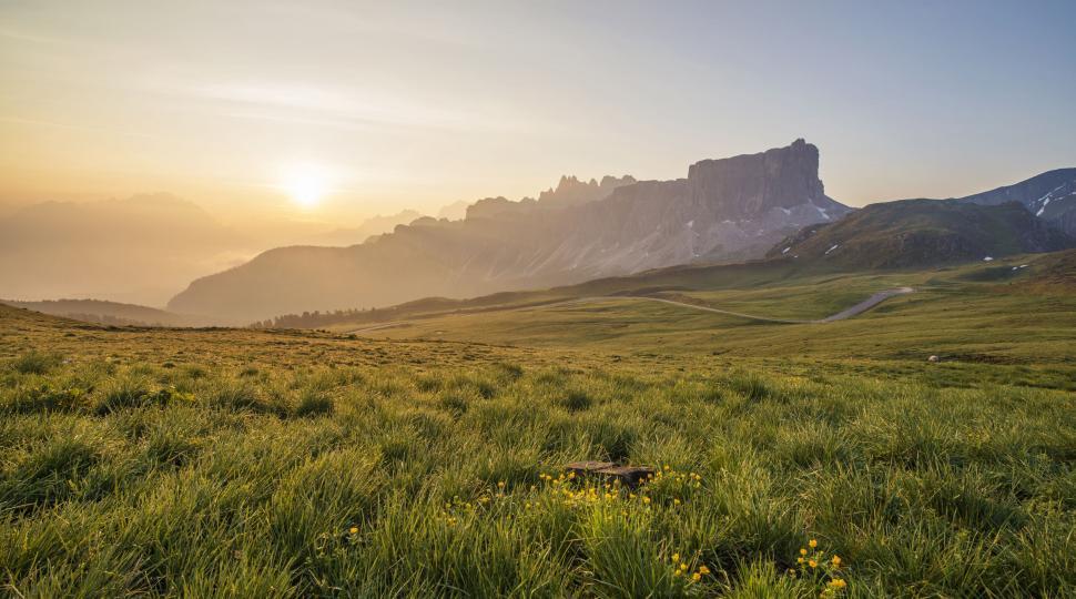 Free Image of Grassy Field With Mountains in the Background 