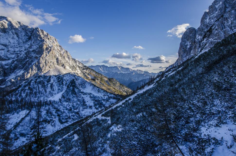 Free Image of Snow Covered Mountain Range Under Blue Sky 