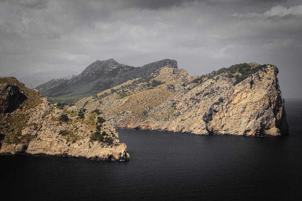 Free Image of Rock Formation Amidst Body of Water 