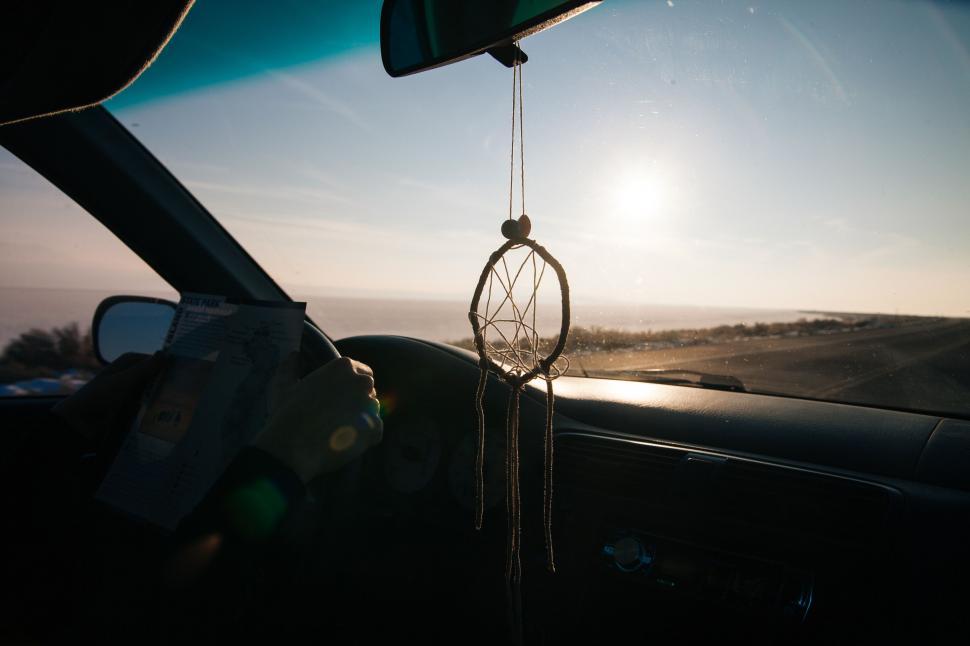 Free Image of Sun Shining Through Car Windshield 