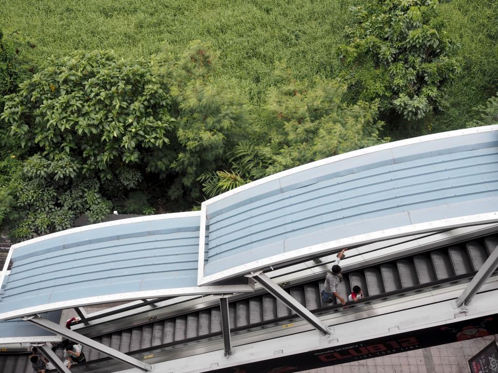 Free Image of Train Station Roof With Mountain Background 