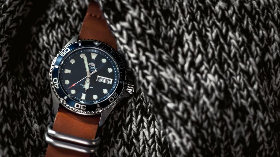Free Image of Watch on Black and White Jacket 
