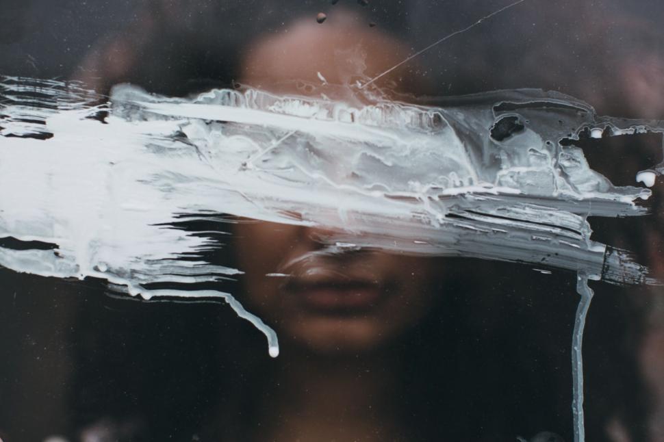 Free Image of Womans Face Reflected in Window 