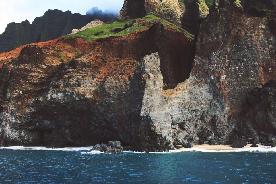 Free Image of Large Rock Outcropping in the Middle of the Ocean 