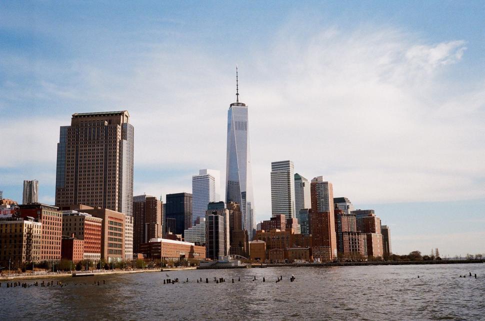 Free Image of Cityscape Across Vast Body of Water 