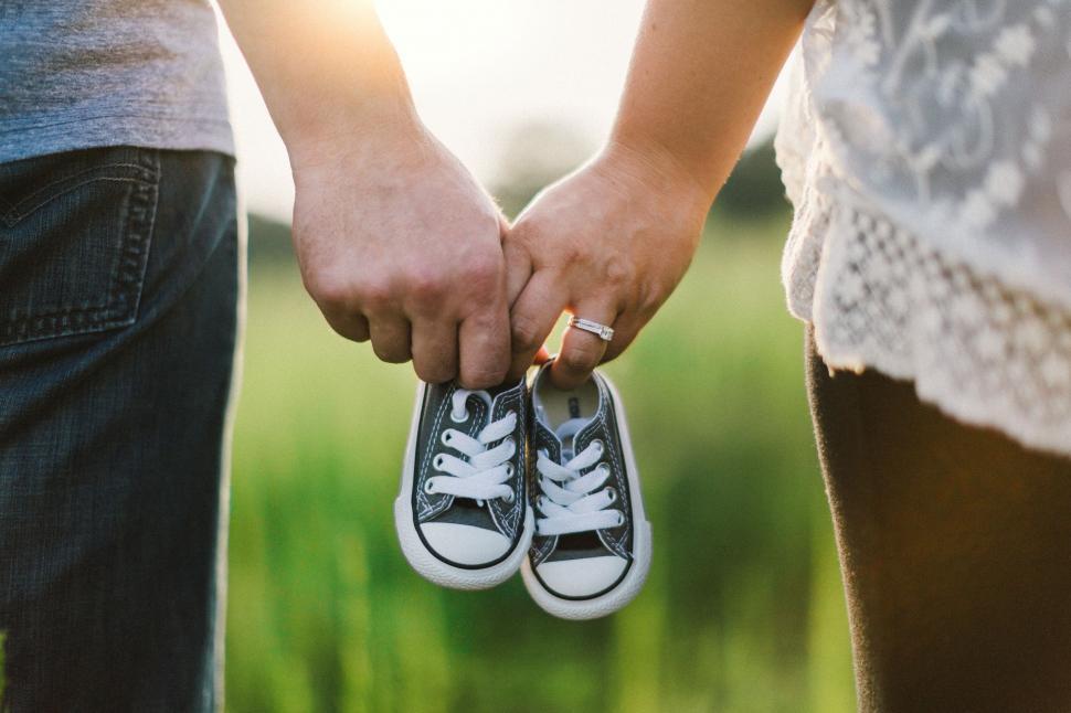 Free Image of Two People Holding Hands Close Up 