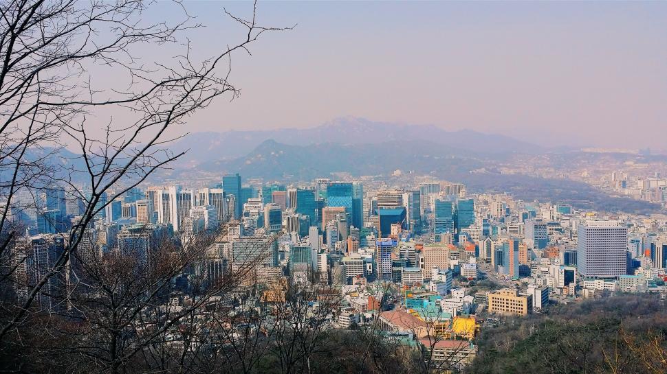 Free Image of City View With Mountains in the Background 