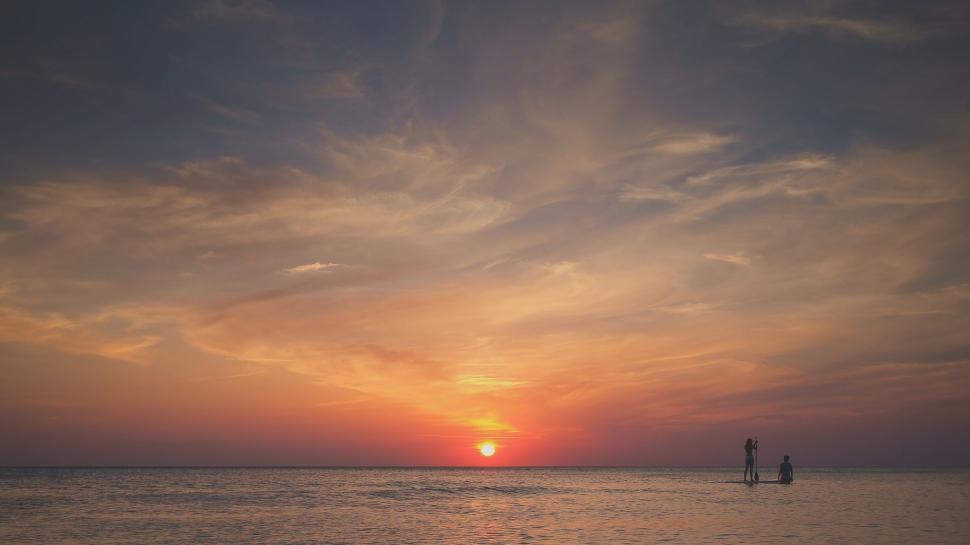 Free Image of Couple Standing on Boat in Ocean 