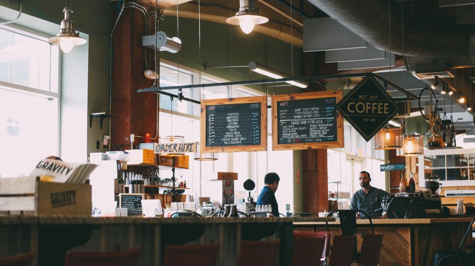 Free Image of People Sitting at the Counter in a Coffee Shop 