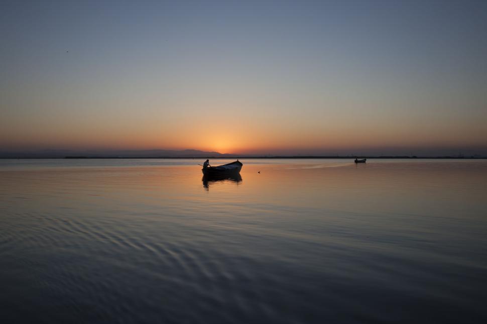 Free Image of Boat Floating on Large Body of Water 