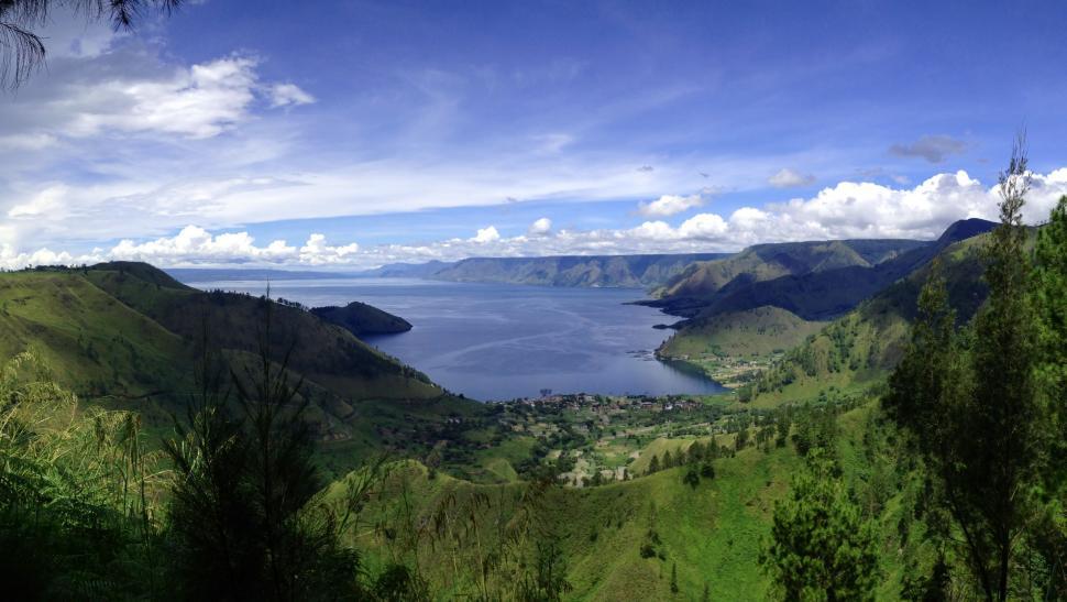 Free Image of Scenic View of a Lake Surrounded by Trees 