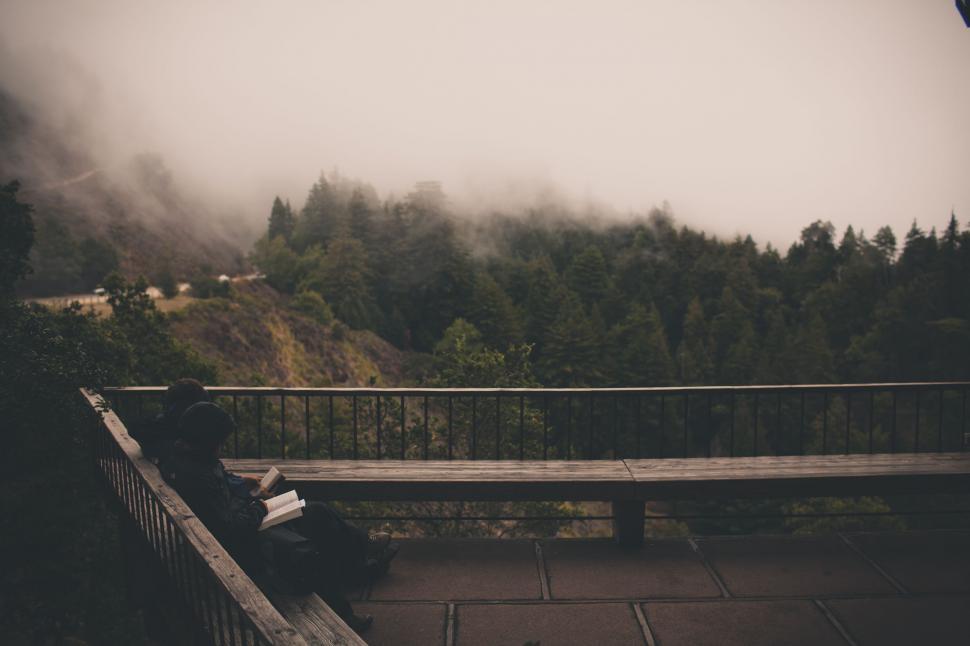 Free Image of Person Sitting on Bench in Black and White 