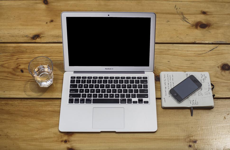 Free Image of Open Laptop Computer on Wooden Table 