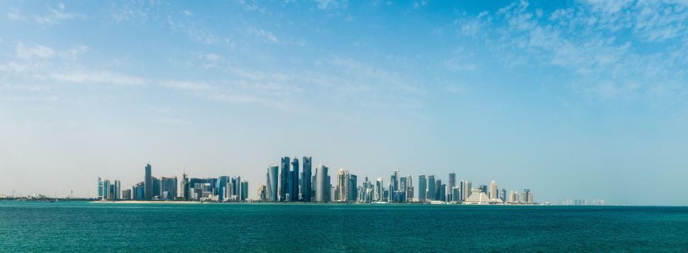 Free Image of City Skyline Overlooking Vast Water 