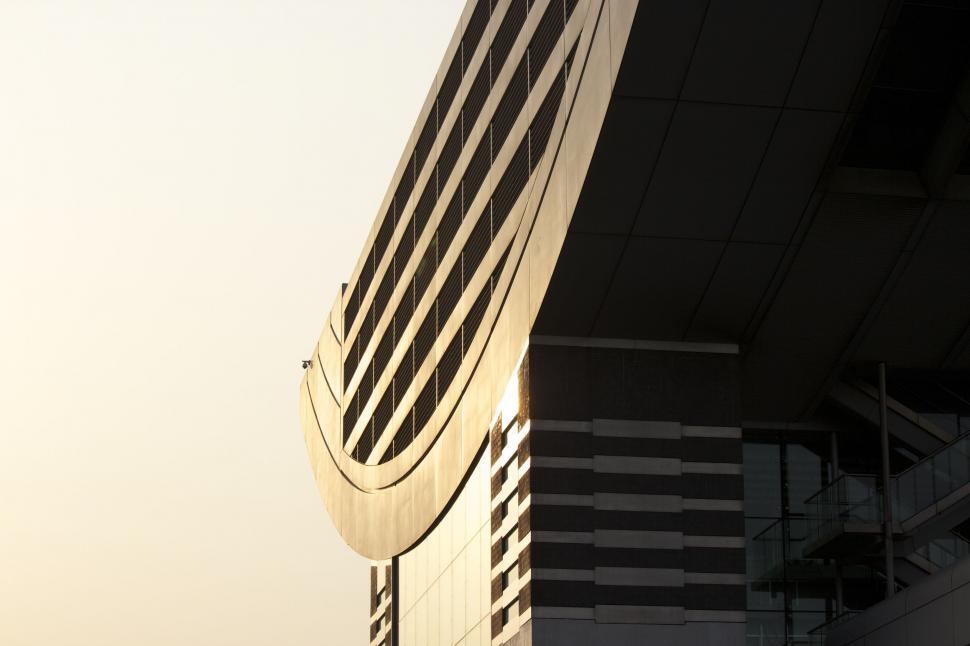 Free Image of Clock on the Side of a Tall Building 