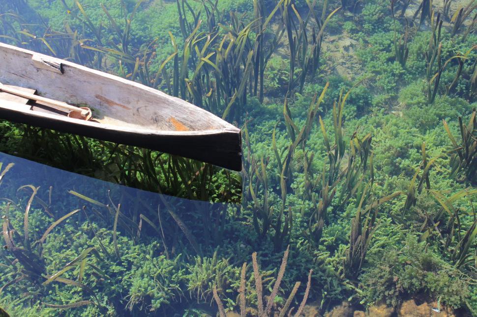 Free Image of Small Boat Floating on a Body of Water 
