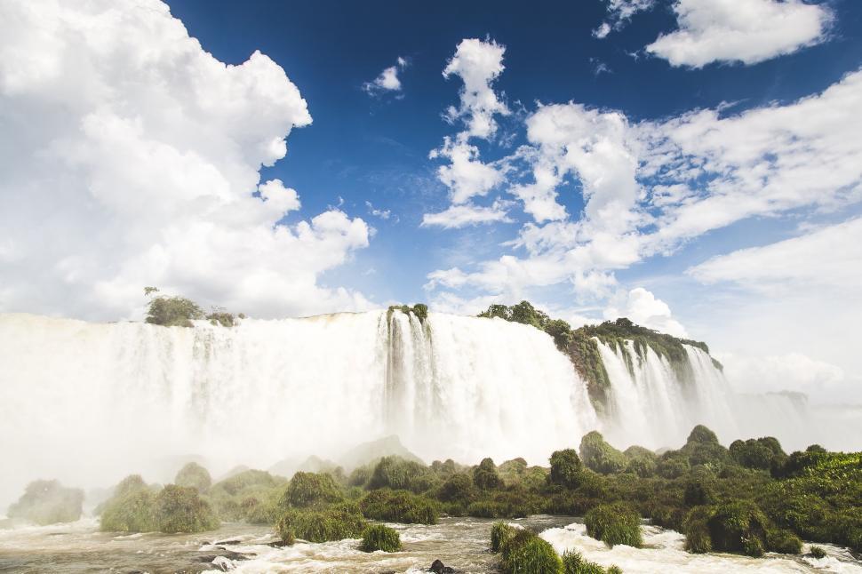 Free Image of Majestic Waterfall in Dense Forest 