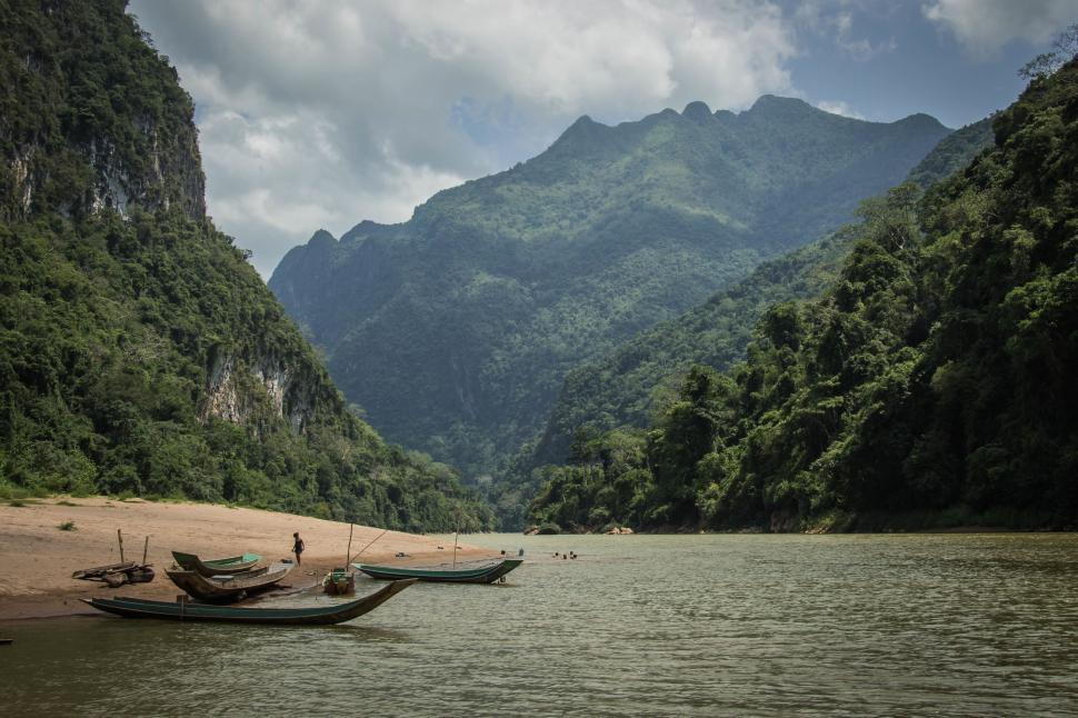 Free Image of Group of Boats Floating on Top of a River 