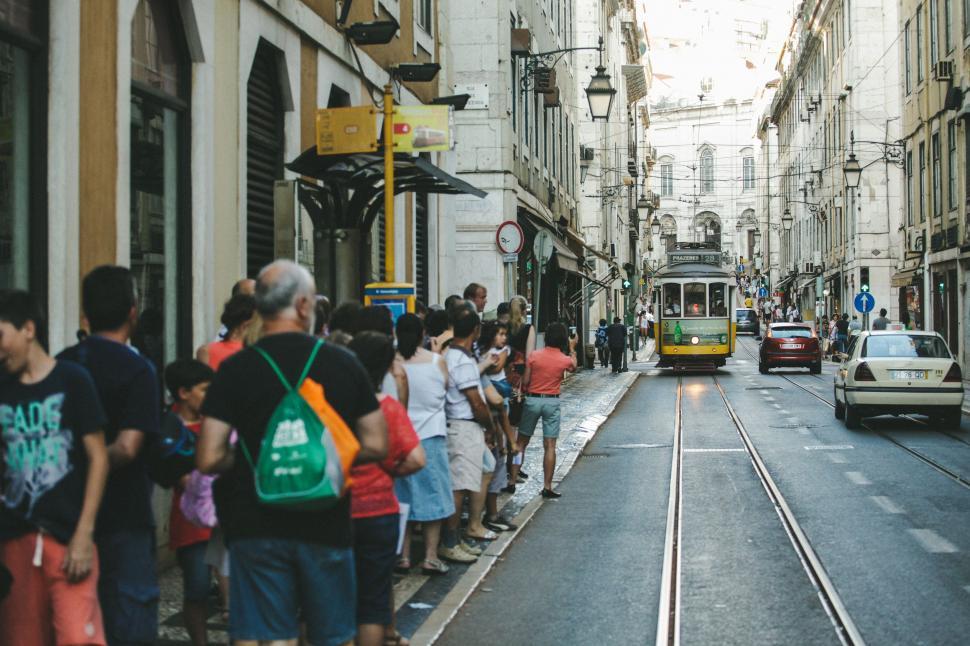 Free Image of Group of People Standing on Sidewalk 