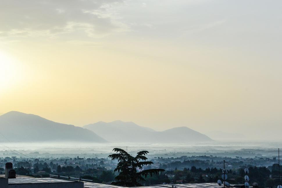 Free Image of City Skyline With Distant Mountains 