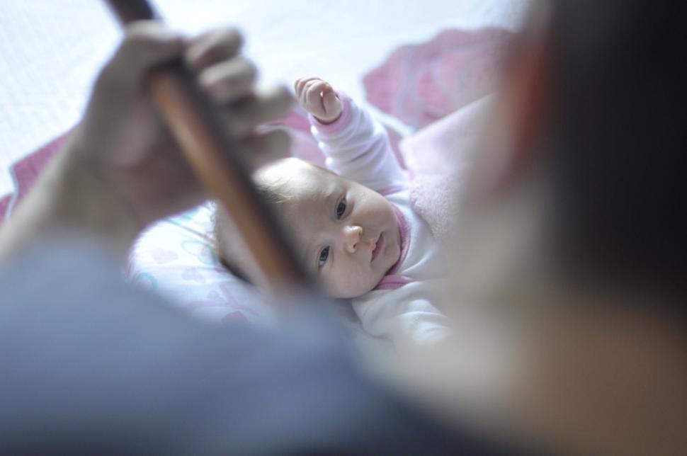 Free Image of Woman Holding a Baby in Her Arms 