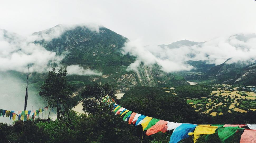 Free Image of Mountain With Colorful Flags Hanging 