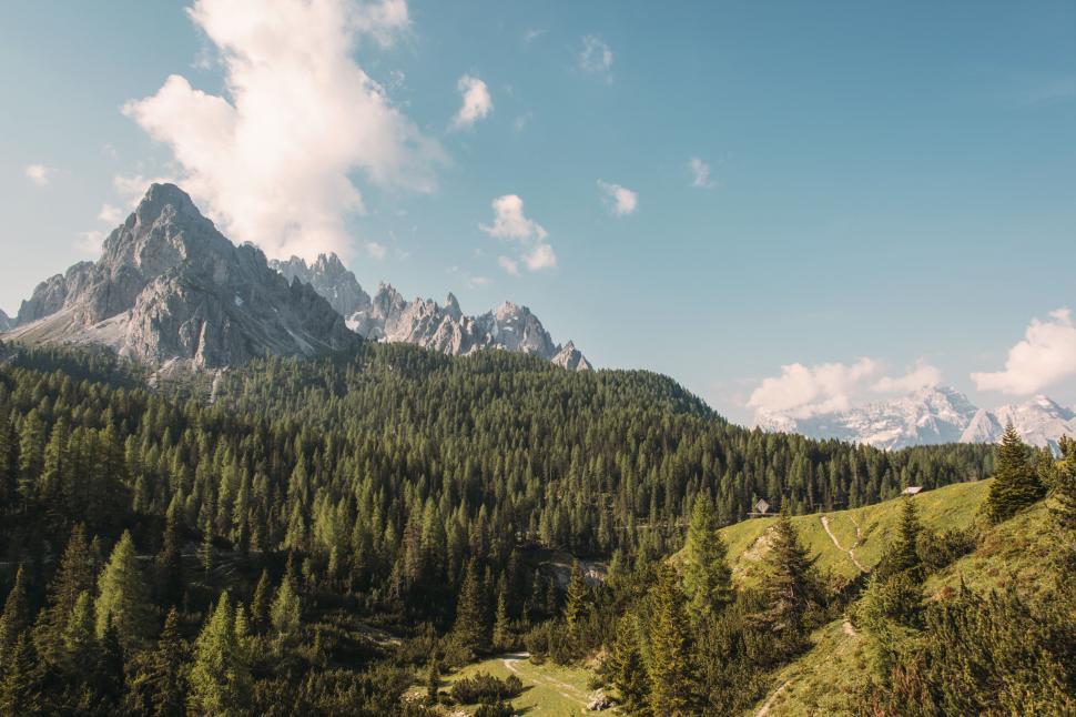 Free Image of Majestic Mountain Range With Trees in Foreground 