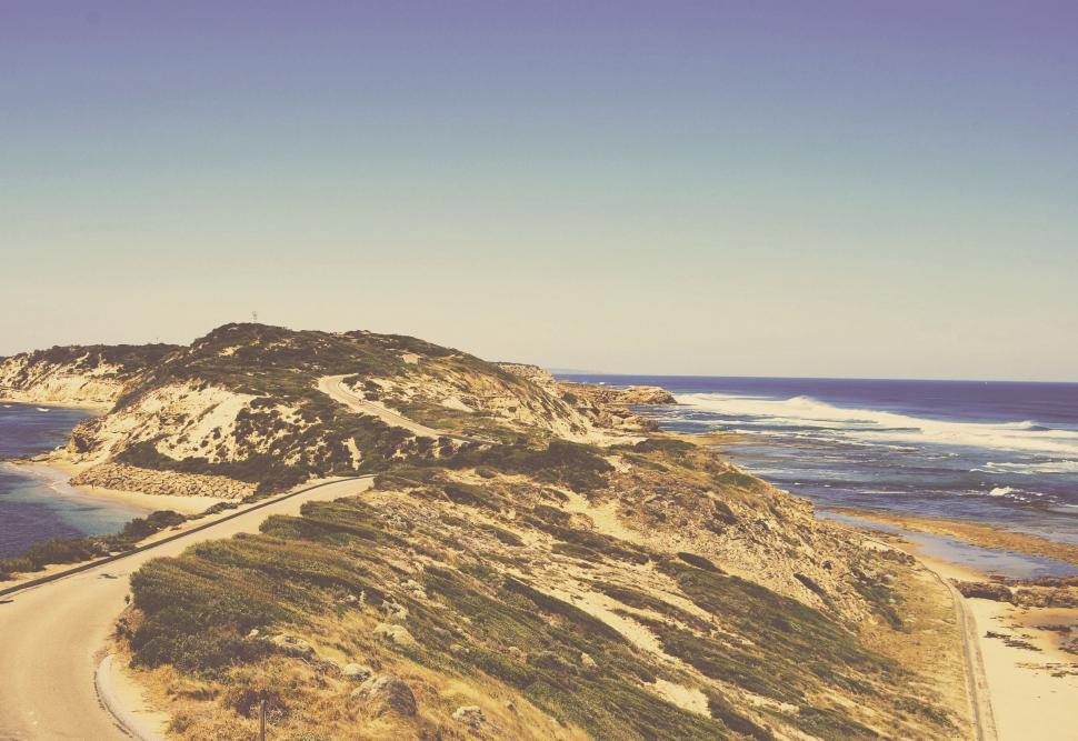 Free Image of Scenic View of Beach and Body of Water 