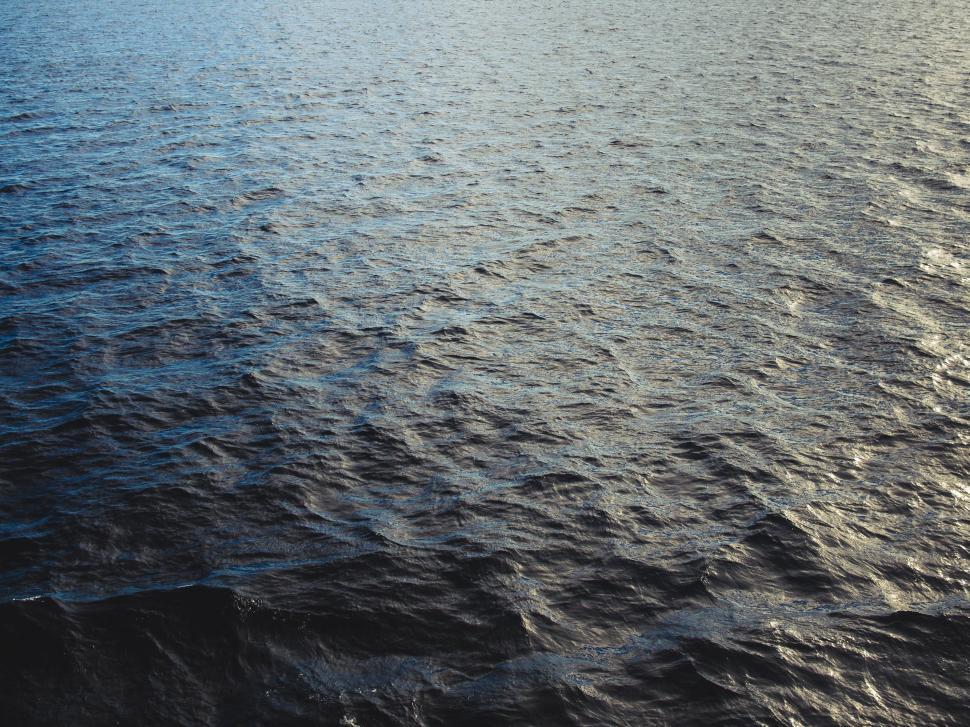 Free Image of Boat Sailing Across Vast Water 