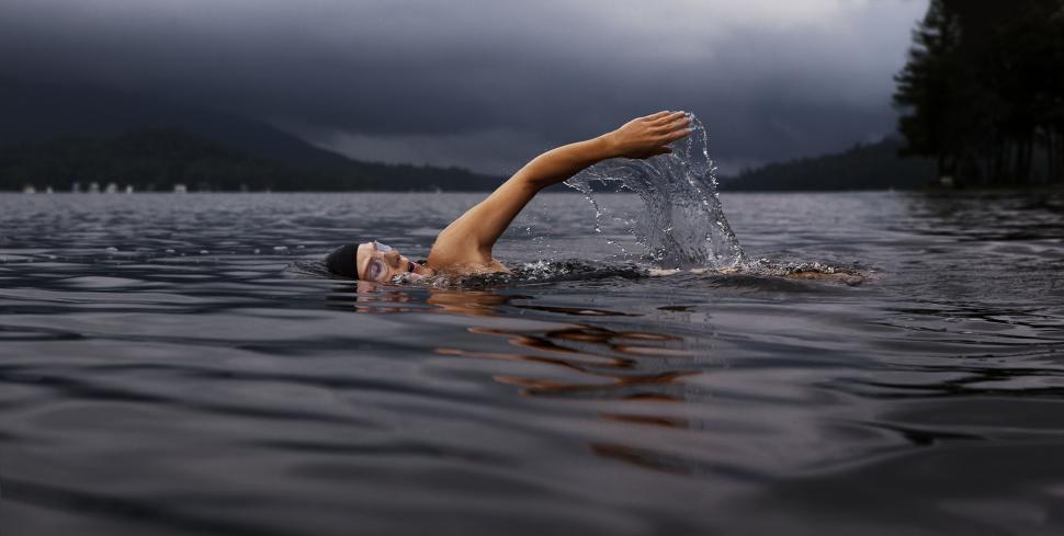 Free Image of Person Swimming in a Lake 