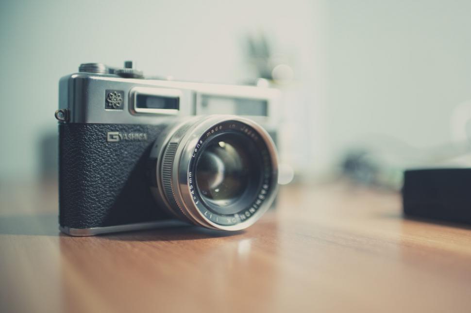 Free Image of Camera on Wooden Table 