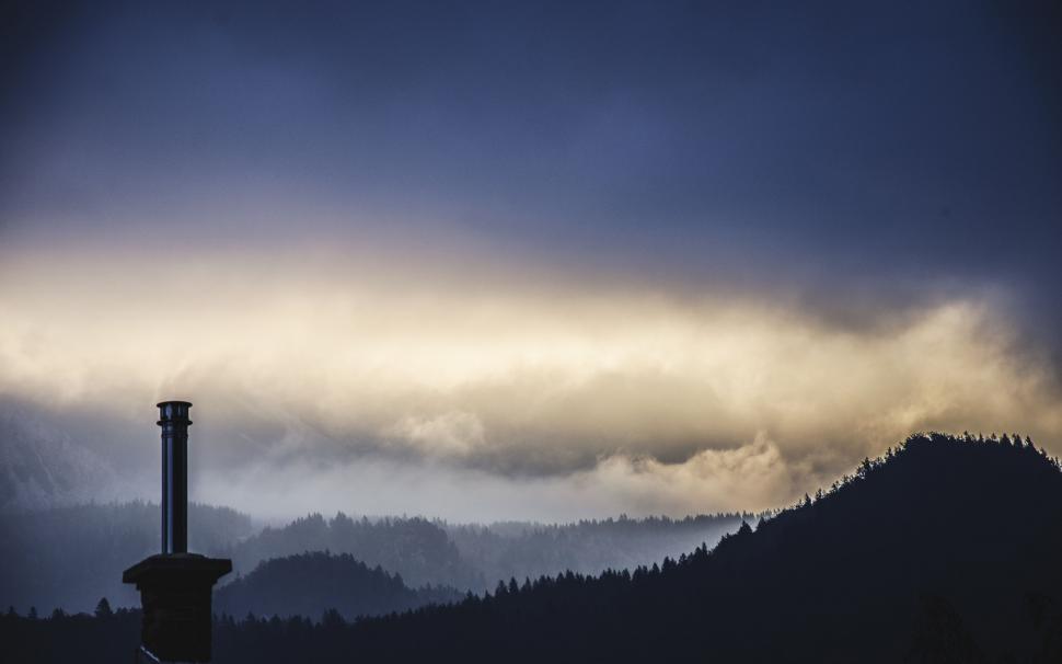 Free Image of Majestic Mountain Range With Clouds in the Sky 