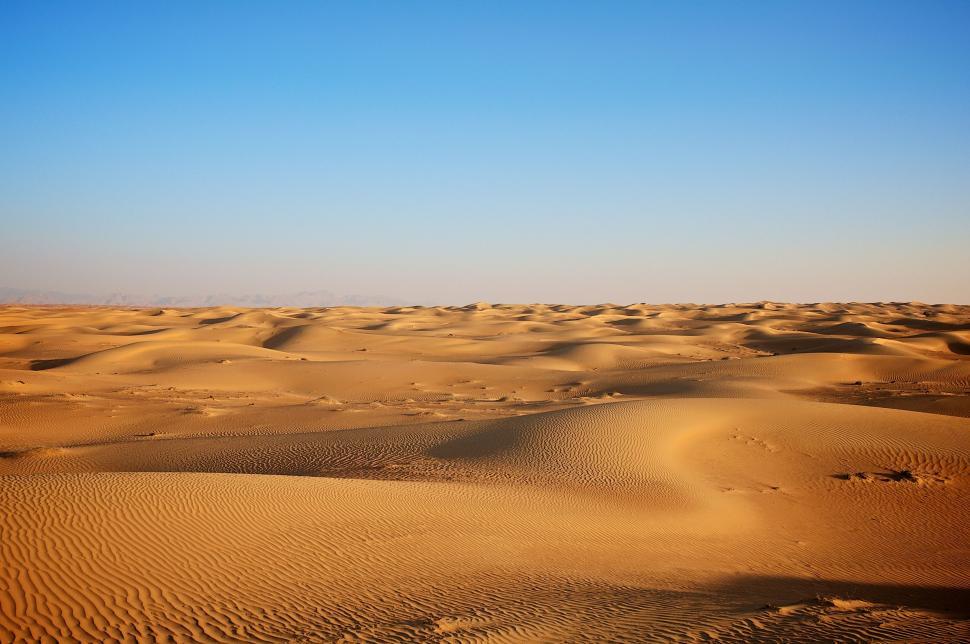 Free Image of Desert Landscape With Sand Dunes and Blue Sky 