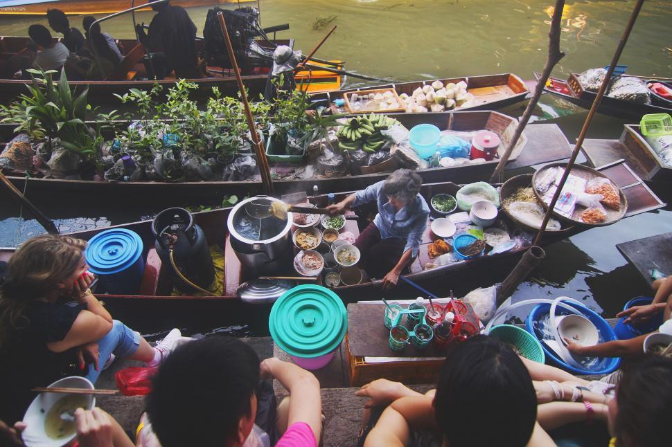 Free Image of Group of People Sitting on Top of a Boat 