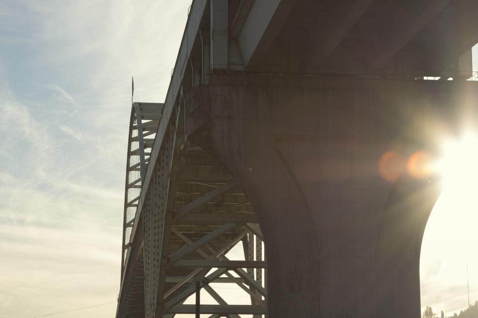 Free Image of Sun Shining Brightly Through the Bridge 
