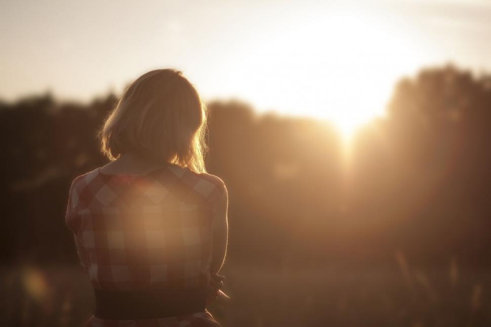 Free Image of Woman Standing Facing Sun 
