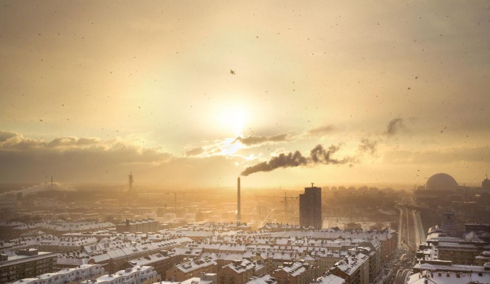 Free Image of Sun Setting Over City Skyline 