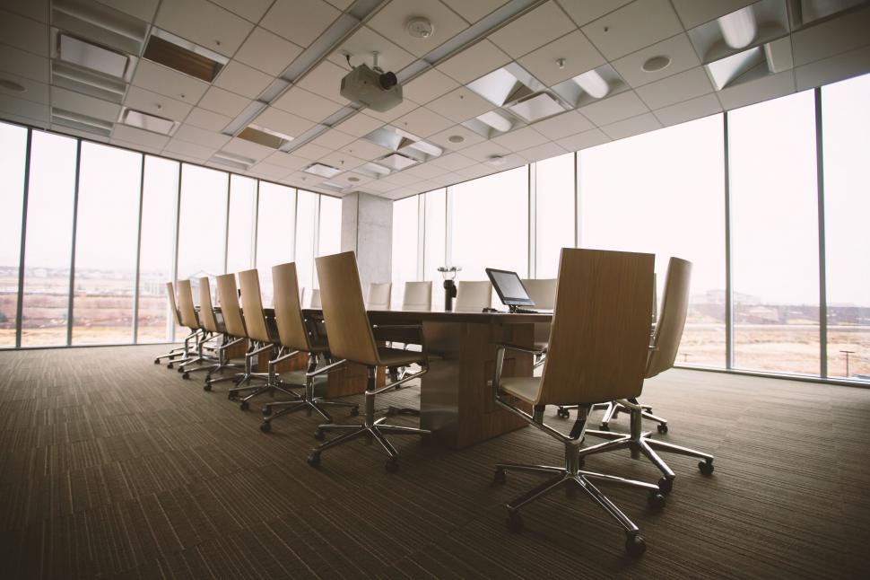 Free Image of Conference Room With Long Table and Chairs 