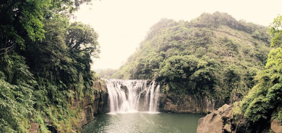 Free Image of Majestic Waterfall in Lush Forest 