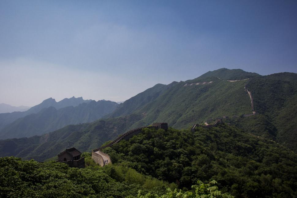 Free Image of Majestic Mountain Range With Bird Flying Overhead 
