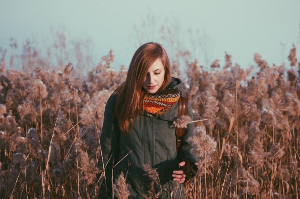 Free Image of Woman Standing in Field of Tall Grass 