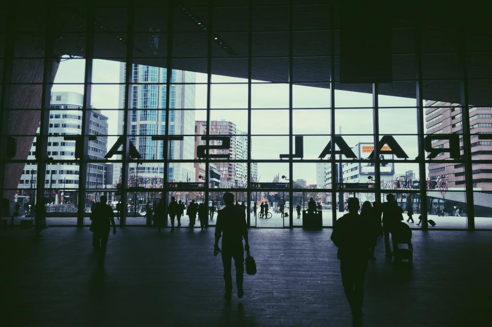 Free Image of Group of People Walking Inside a Building 
