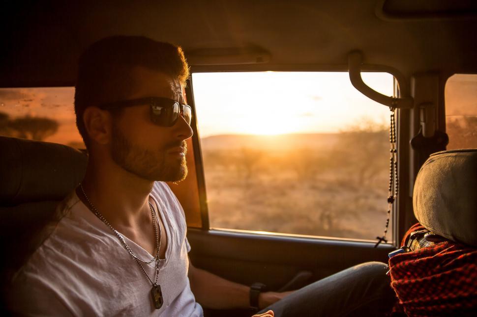 Free Image of Man Sitting in the Back Seat of a Car 