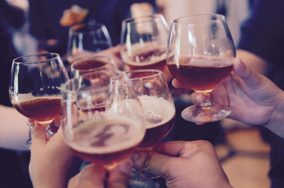 Free Image of Group of People Holding Up Wine Glasses 